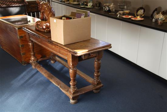 An early 18th century Spanish walnut draw leaf table, 10ft 5in. x 1ft 10in. x 2ft 6in.